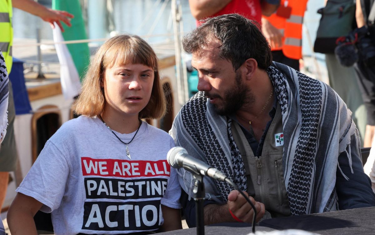 Brazilian activist Thiago Avila speaks to Swedish activist Greta Thunberg during a press conference before the departure of the Global Sumud Flotilla, a humanitarian expedition to Gaza, at the port of Barcelona, Spain August 31, 2025. REUTERS/Eva Manez
