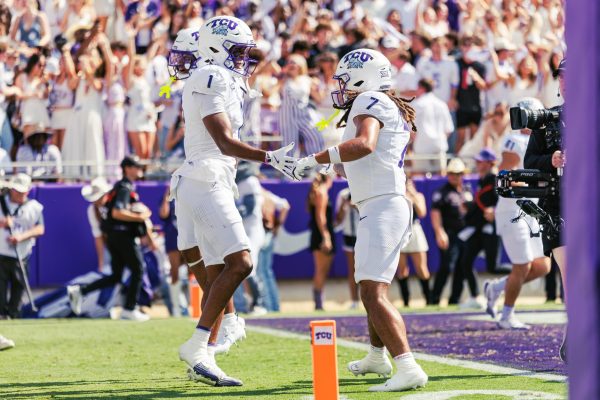 TCU wide receivers Jordan Dwyer and Eric McCallister celebrate after the play at Amon G. Carter Stadium in Fort Worth, Texas, Sep. 20, 2025. The TCU Horned Frogs beat the SMU Mustangs 35-24. (TCU360/Tyler Chan)