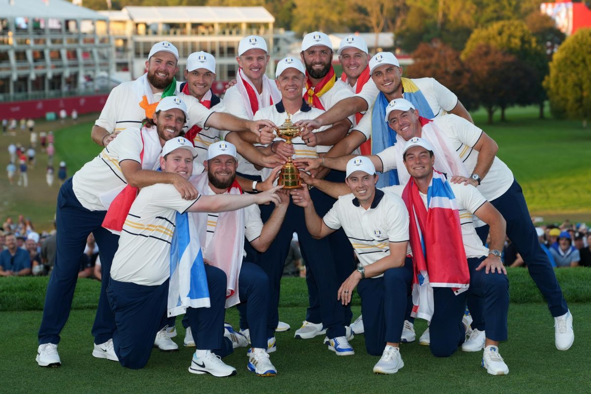 Team Europe poses with the trophy after taking the victory against Team USA at the Ryder Cup golf tournament on the Bethpage Black golf course, Sunday, Sept. 28, 2025, in Farmingdale, N.Y. (AP Photo/Matt Slocum)