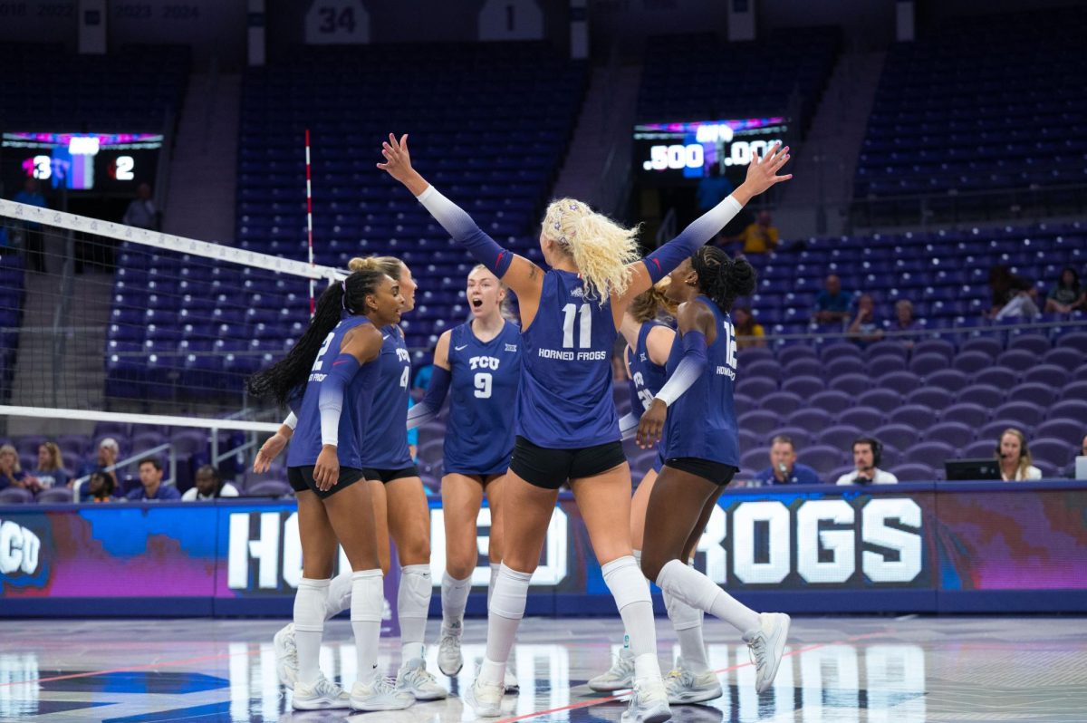 TCU volleyball players celebrate winning the point. The TCU Horned Frogs beat the Wyoming Cowgirls 3-0 at Schollmaier Arena in Fort Worth, Texas, Sep. 11, 2025. (TCU360/Keegan Schmidt)