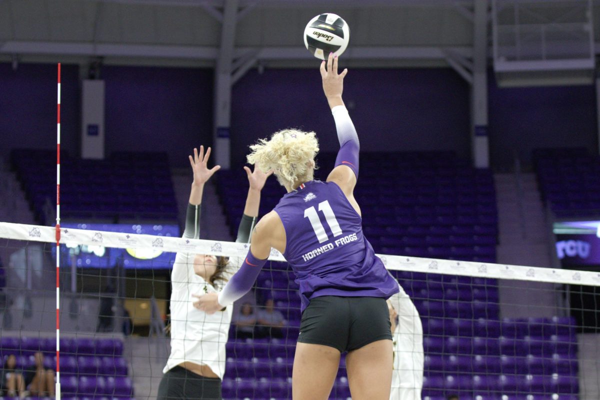 TCU outside hitter Becca Kelley tips the ball over the Missouri block at Schollmaier Arena in Fort Worth, Texas Sep. 12, 2025. The TCU Horned Frogs defeated the Missouri Tigers 3-1 (TCU360/Logan Pope).