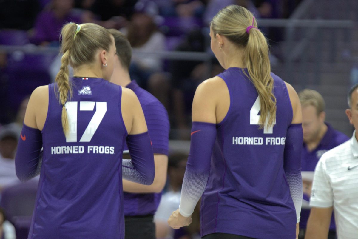 TCU setter Rosemary Archer (left) and middle blocker Sarah Sylvester (right) talk during a timeout at Schollmaier Arena in Fort Worth, Texas Sep. 12, 2025. The TCU Horned Frogs defeated the Missouri Tigers 3-1 (TCU360/Logan Pope).