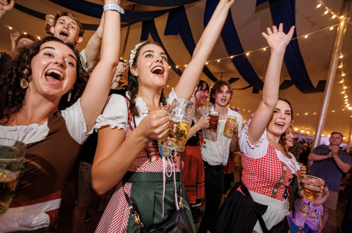 Individuals at Oktoberfest. 
Promotional photo courtesy of fortworthoktoberfest.com/about/gallery/