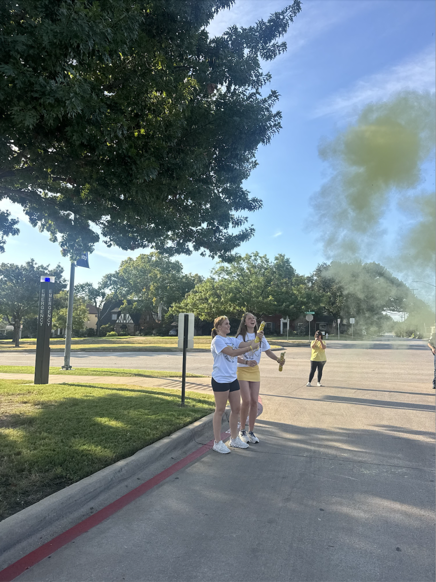 Shelby Sannar sends runners off with yellow powder cannons at SNA’s Childhood Cancer Awareness 5k Ribbon Run, Sept. 28, 2025. 
