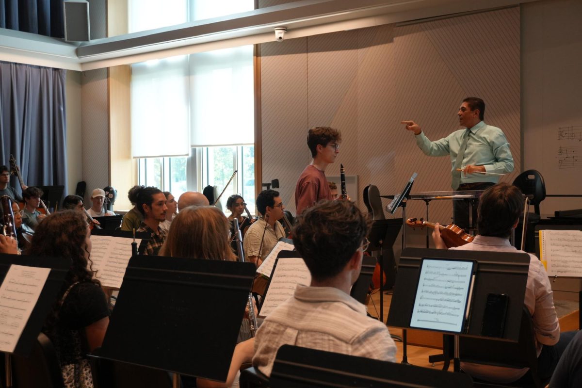 Germán Gutiérrez, the founder of the festival, conducts the orchestra during one of their many rehearsals. (Macy Bayer/Staff Writer)
