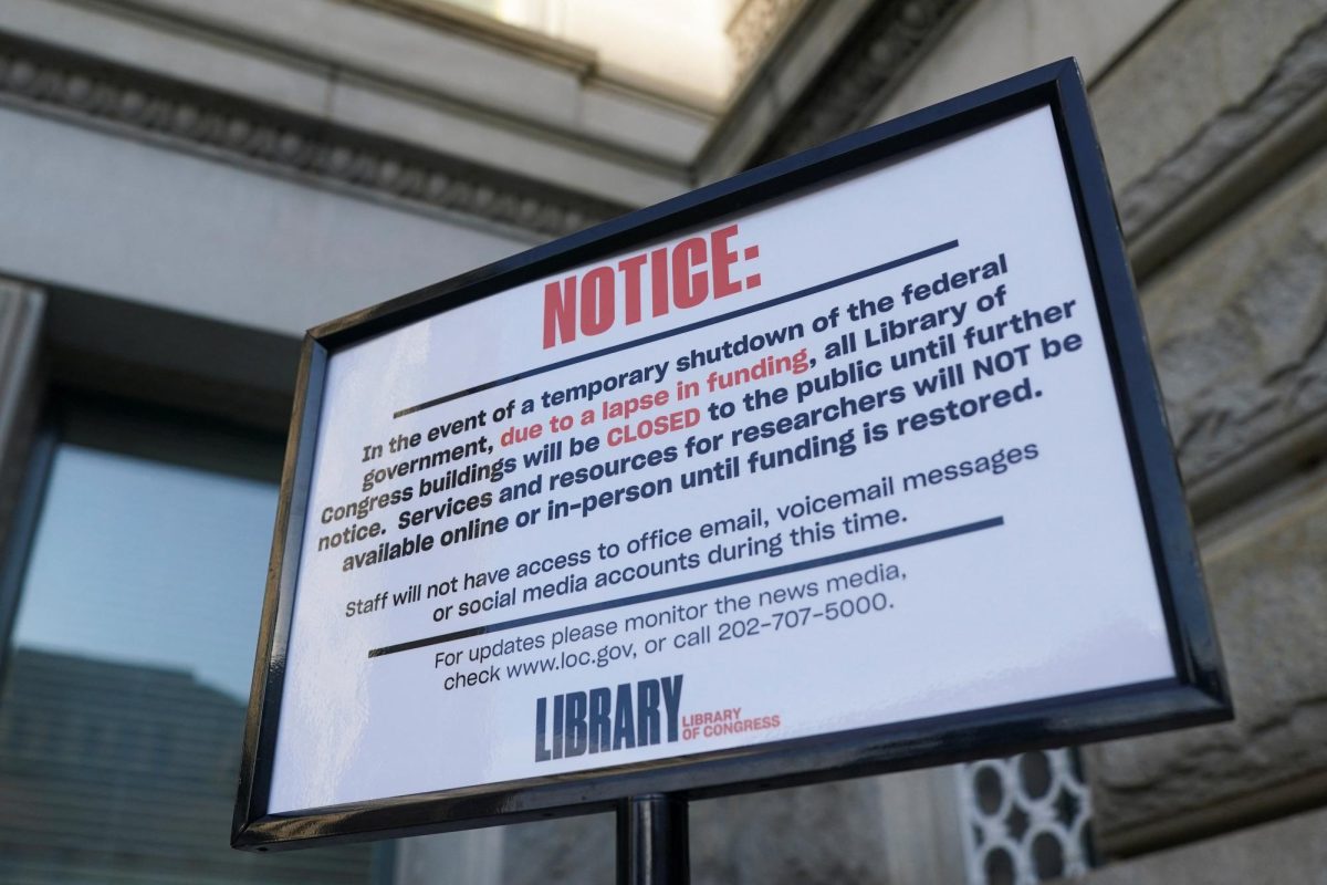 A sign stands outside the Library of Congress on the first day of a partial government shutdown in Washington, D.C., U.S., October 1, 2025. REUTERS/Nathan Howard