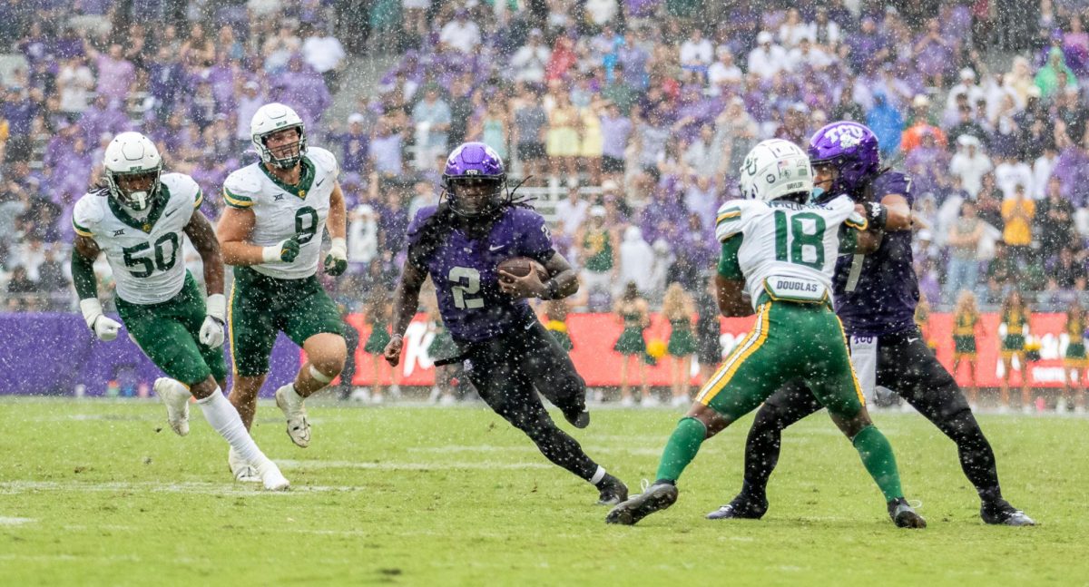 In heavy rain, TCU running back Kevorian Barnes runs the ball towards the end zone at Amon G. Carter Stadium in Fort Worth, Texas Oct 18, 2025. The TCU Horned Frogs defeated the Baylor Bears 42-36 (TCU360/Logan Pope).