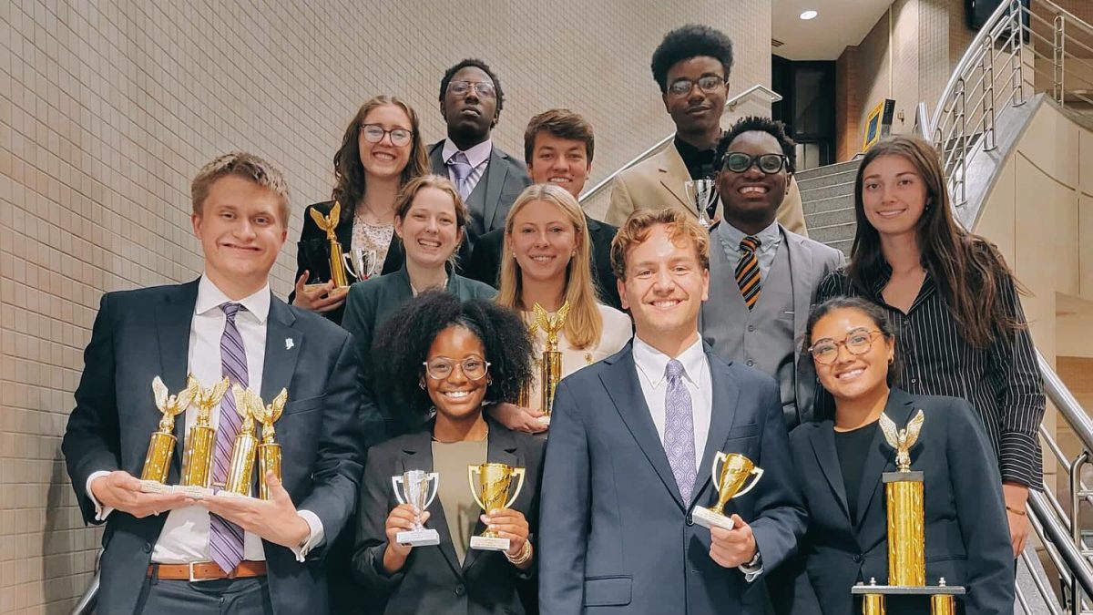 The TCU Speech & Debate team with their trophies from the first competition of the 2025-26 season.