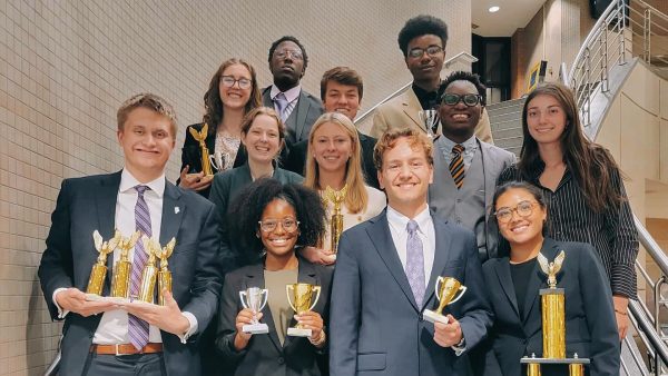 The TCU Speech & Debate team with their trophies from the first competition of the 2025-26 season.