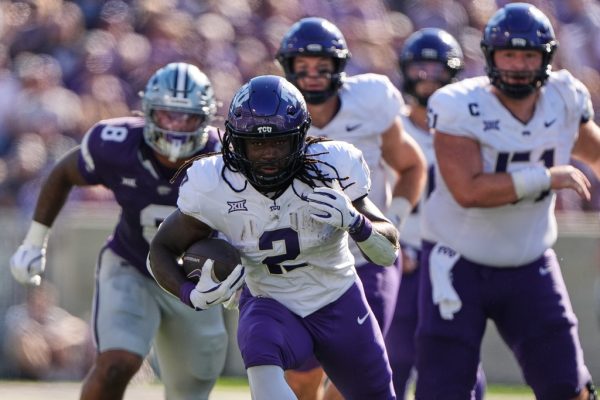 TCU running back Kevorian Barnes runs the ball during the first half of an NCAA college football game against Kansas State, Saturday, Oct. 11, 2025, in Manhattan, Kan. (AP Photo/Charlie Riedel)