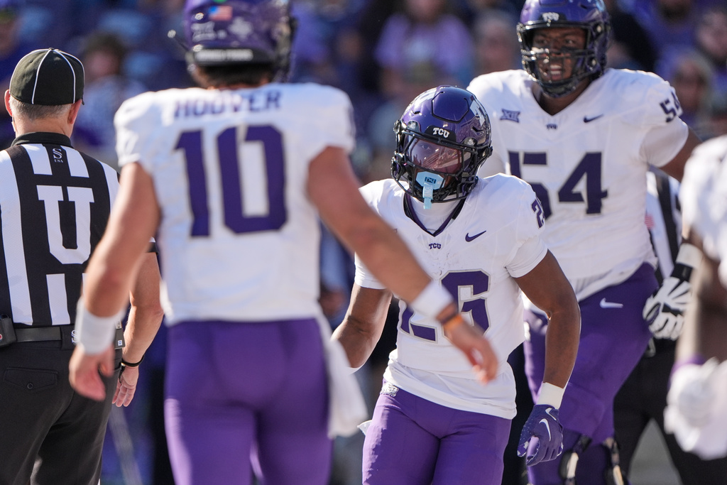 TCU running back Jeremy Payne, center, runs off the field after scoring a touchdown during the first half of an NCAA college football game against Kansas State, Saturday, Oct. 11, 2025, in Manhattan, Kan. (AP Photo/Charlie Riedel)