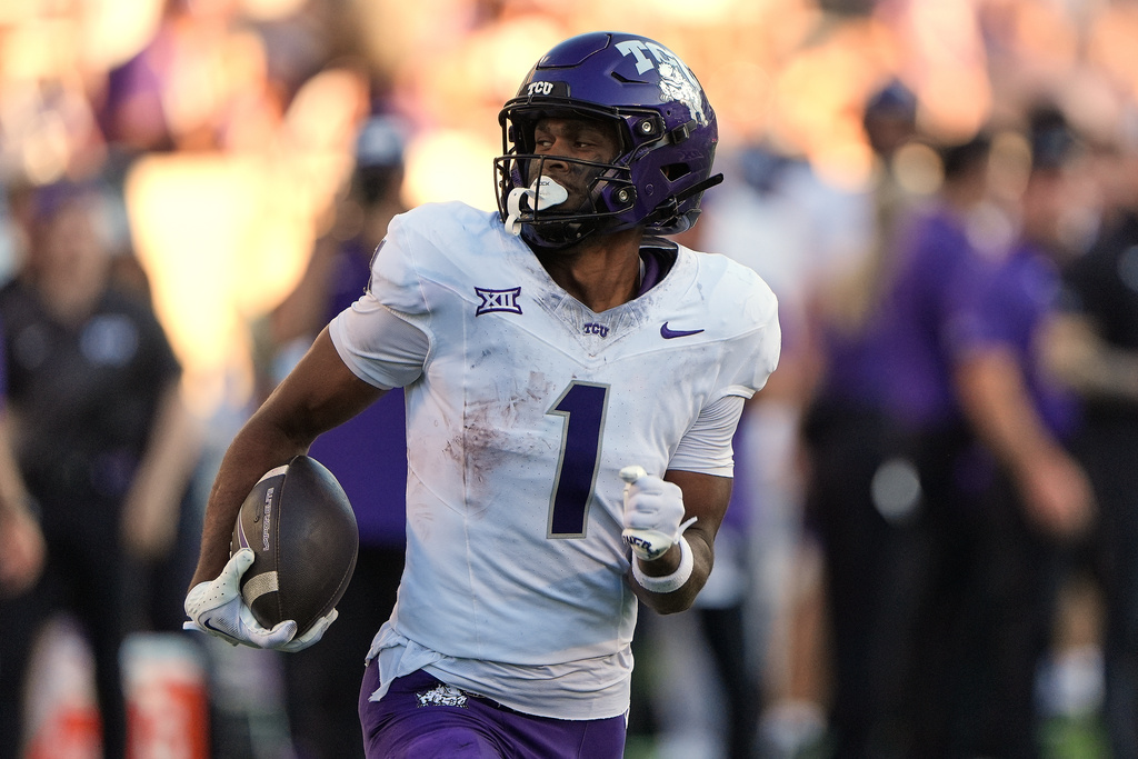 TCU wide receiver Eric McAlister runs 85 yards for a touchdown during the second half of an NCAA college football game against Kansas State, Saturday, Oct. 11, 2025, in Manhattan, Kan. (AP Photo/Charlie Riedel)