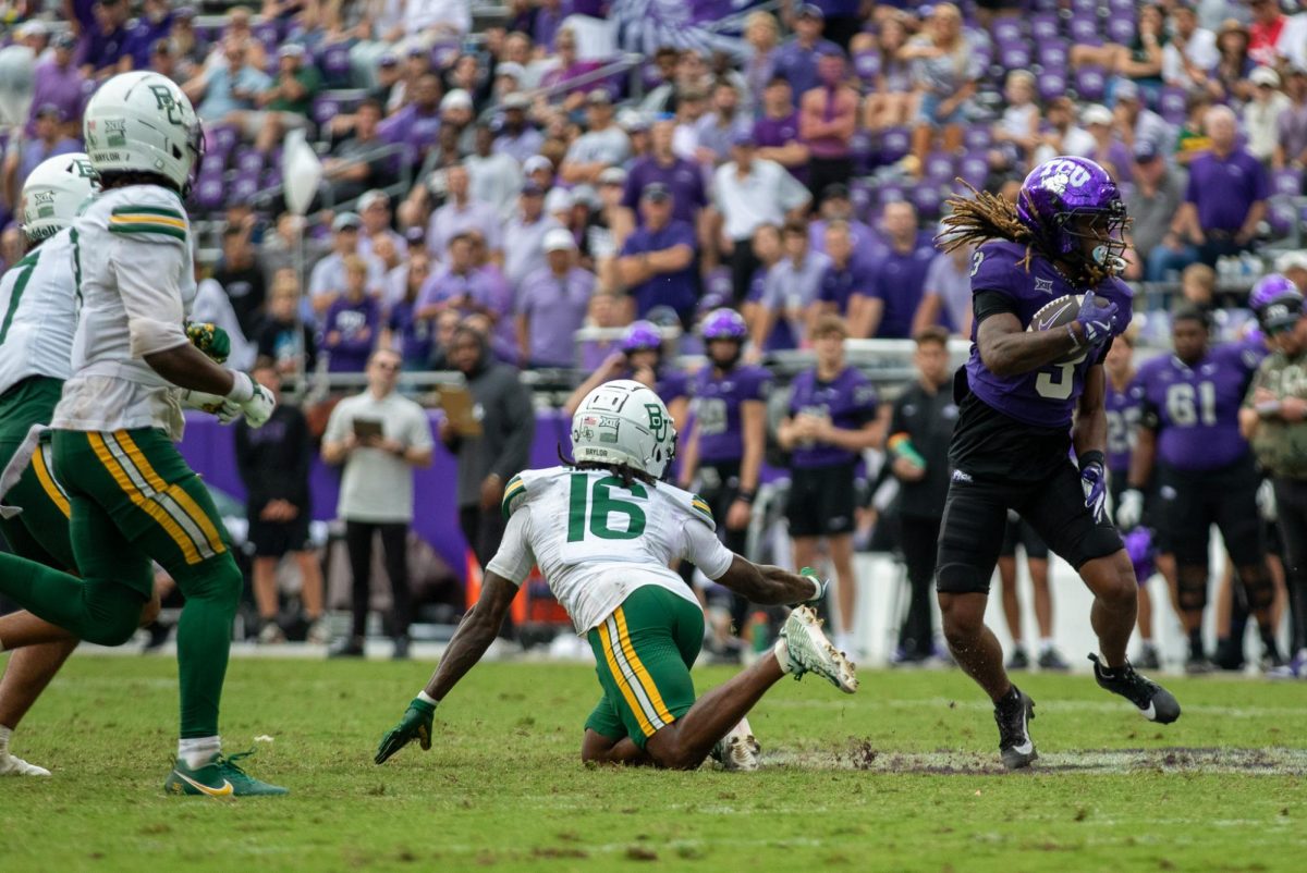 TCU wide receiver Major Everhart jukes away from Baylor safety Kendrick Simpkins (16) at Amon G. Carter Stadium in Fort Worth, Texas Oct 18, 2025. The TCU Horned Frogs defeated the Baylor Bears 42-36 (TCU360/Logan Pope).