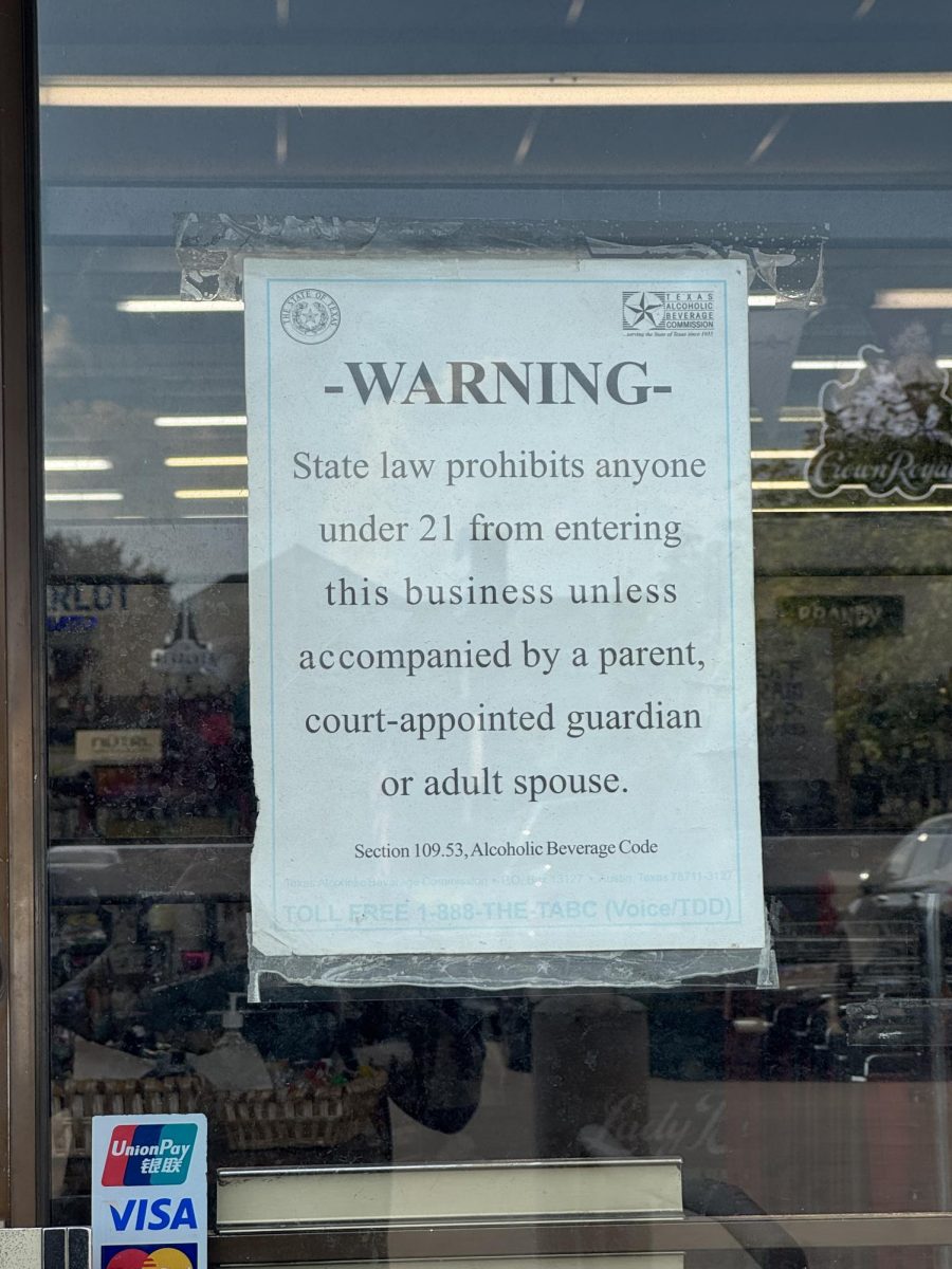 A warning sign is posted outside of King's Liquor on West Berry St. stating persons under 21 are not permitted in the store. Oct 3, 2025. 