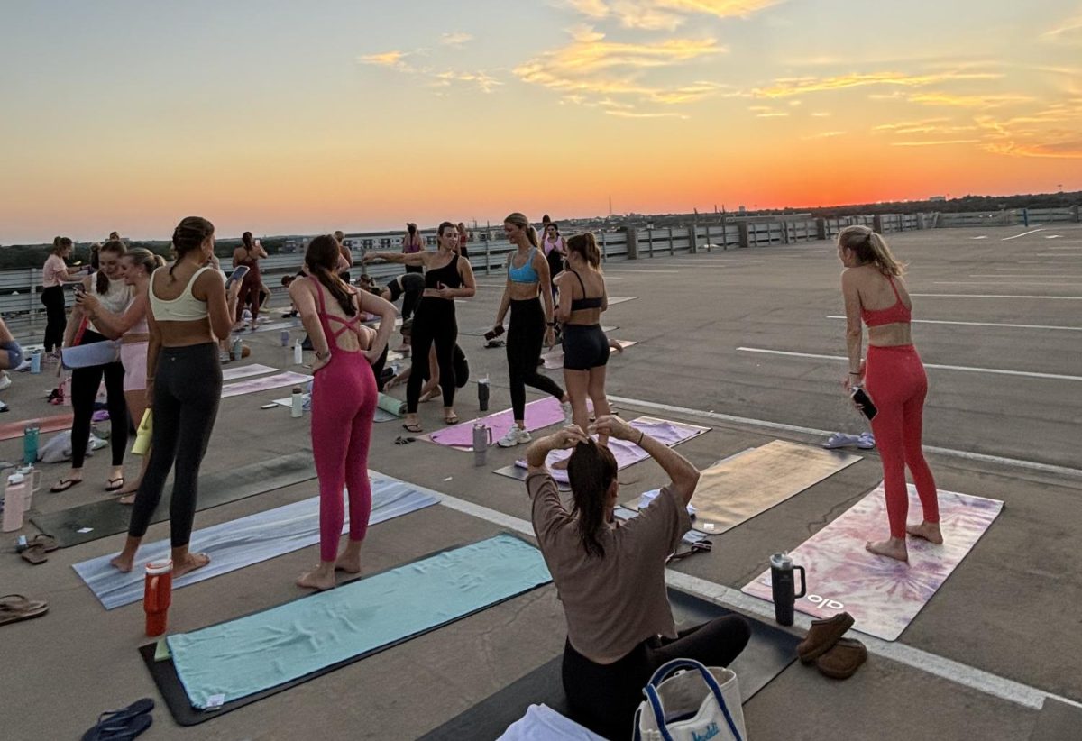 A CorePower class taught on top of the Frog Alley parking garage.
