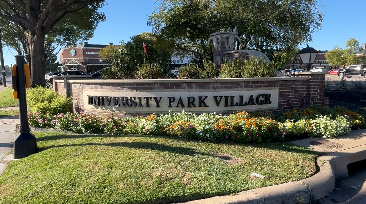 Entrance sign into University Park Village off S. University Drive