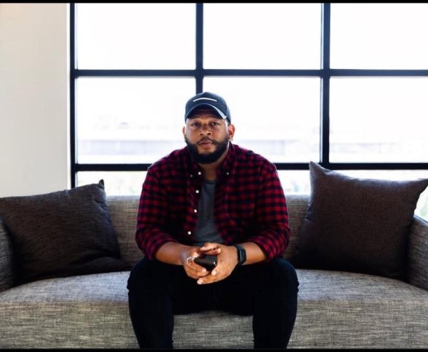 Jae Oats sitting down at a photoshoot in Friso, Texas. (Courtesy of Jae Oats)