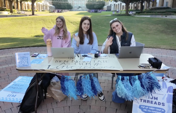 TCU IJM members set up for their annual Threads event in the TCU commons.