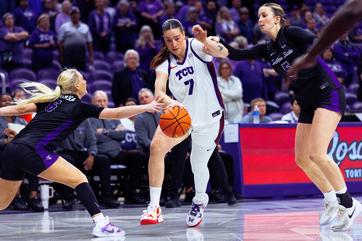 TCU forward Marta Suarez drives past the defenders at Schollmaier Arena in Fort Worth, Texas, Nov. 20, 2025. The TCU Horned Frogs beat the Tarleton State Texans 80-32. (TCU360/ Tyler Chan)