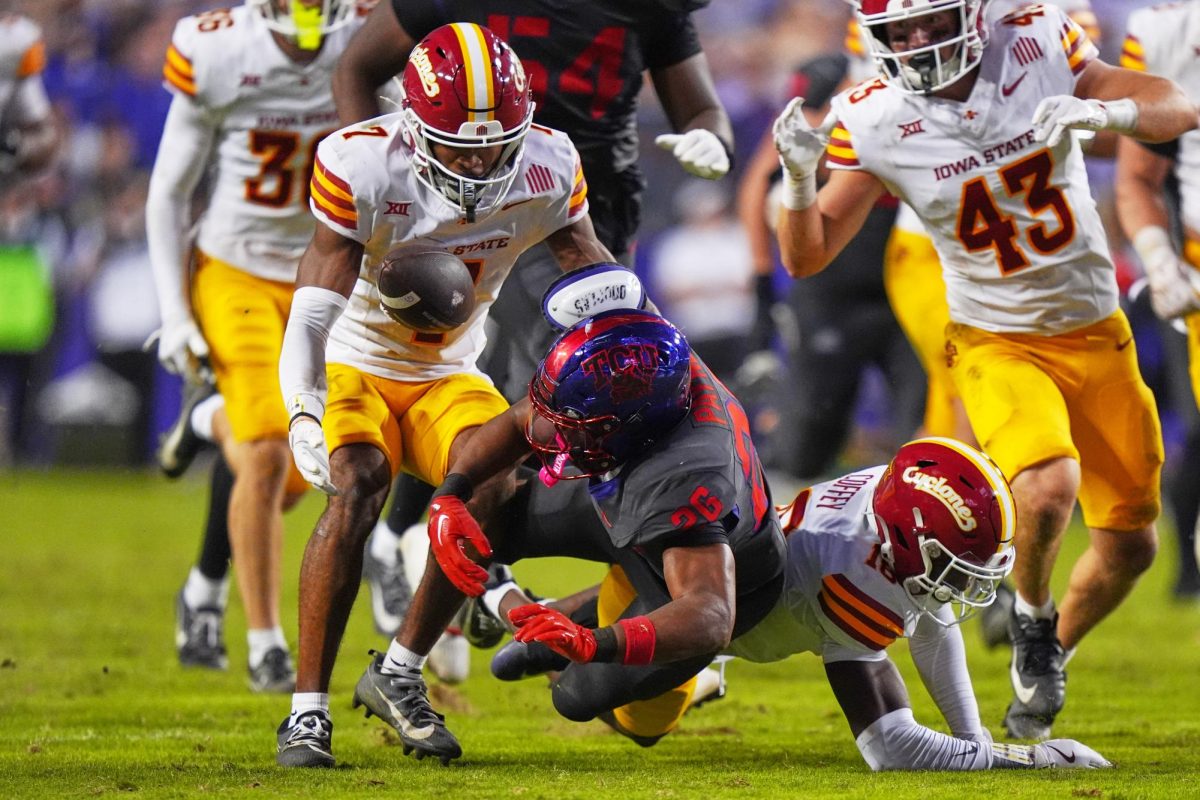 TCU running back Jeremy Payne (26) fumbles the ball against Iowa State defensive backs Tre Bell (7), David Coffey (18) and Caden Matson (43) during the second half of an NCAA college football game Saturday, Nov. 8, 2025, in Fort Worth, Texas. (AP Photo/LM Otero)