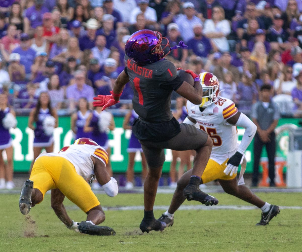 TCU wide receiver Eric McAlister spins away from Iowa State defensive back Tre Bell (7) at Amon G. Carter Stadium in Fort Worth, Texas Nov. 8, 2025. The Horned Frogs lost to the Iowa State Cyclones 20-17 (Logan Pope/TCU360).
