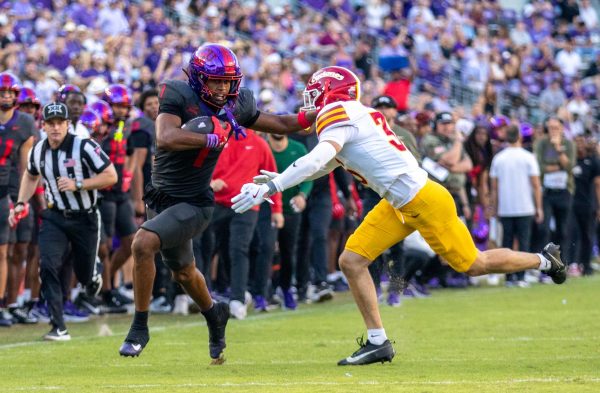 TCU wide receiver Eric McAlister stiff-arms Iowa State defensive back Carson Van Dinter (36) at Amon G. Carter Stadium in Fort Worth, Texas Nov. 8, 2025. The Horned Frogs lost to the Iowa State Cyclones 20-17 (Logan Pope/TCU360).