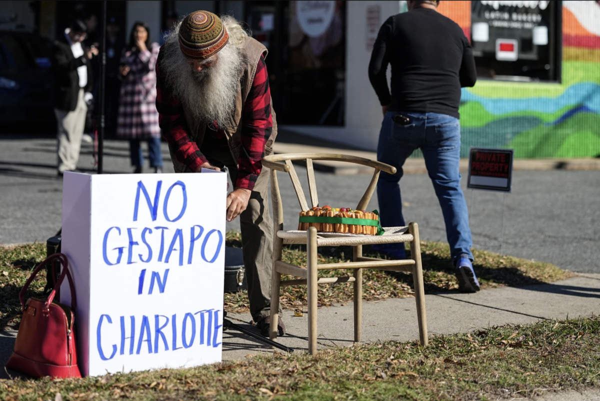 Protesters set up outside of Manolo's Bakery amidst federal law enforcement, Monday, Nov. 17, 2025, in Charlotte, N.C.