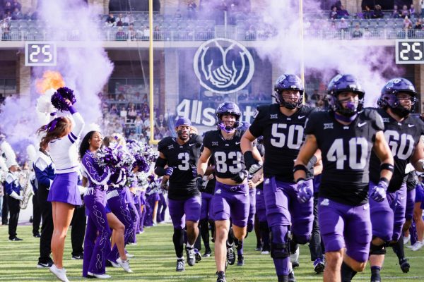 TCU football players take the field amid cheers from fans at Amon G. Carter Stadium in Fort Worth, Texas, on Nov. 29, 2025. The TCU Horned Frogs beat the Cincinnati Bearcats 45-23. (TCU360/Nghia Tran)