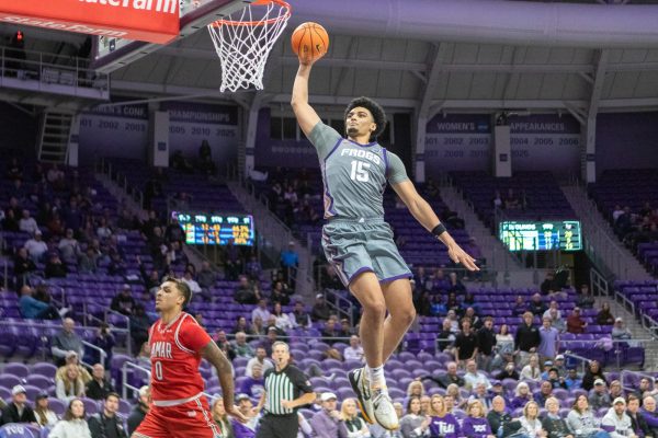 TCU forward David Punch goes up for a dunk at Ed and Rae Schollmaier Arena in Fort Worth, Texas Nov. 10, 2025. The Horned Frogs defeated the Lamar Cardinals 78-65 (TCU360/Logan Pope).