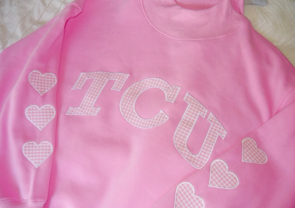After missing out on the Parke drop, TCU sophomore Grace Hebert designed her own pink mock neck sweatshirt through a small business. (Photo courtesy of Grace Hebert)