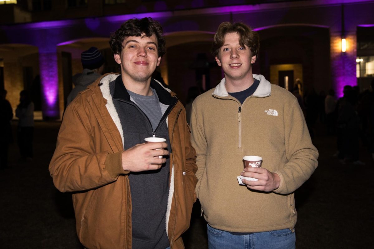 TCU students pose with their hot chocolate during the TCU Tree Lighting celebration in Fort Worth, Texas, Dec. 2, 2025. (TCU360/Tyler Chan)