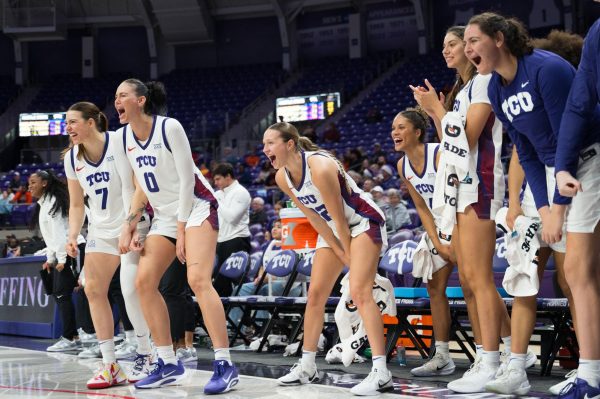 The TCU bench cheers on their teammates on the floor at Schollmaier Arena in Fort Worth, Texas, Dec. 6, 2025. The TCU Horned Frogs beat the University of Texas at El Paso Miners 95-40. (TCU360/Keegan Schmidt)