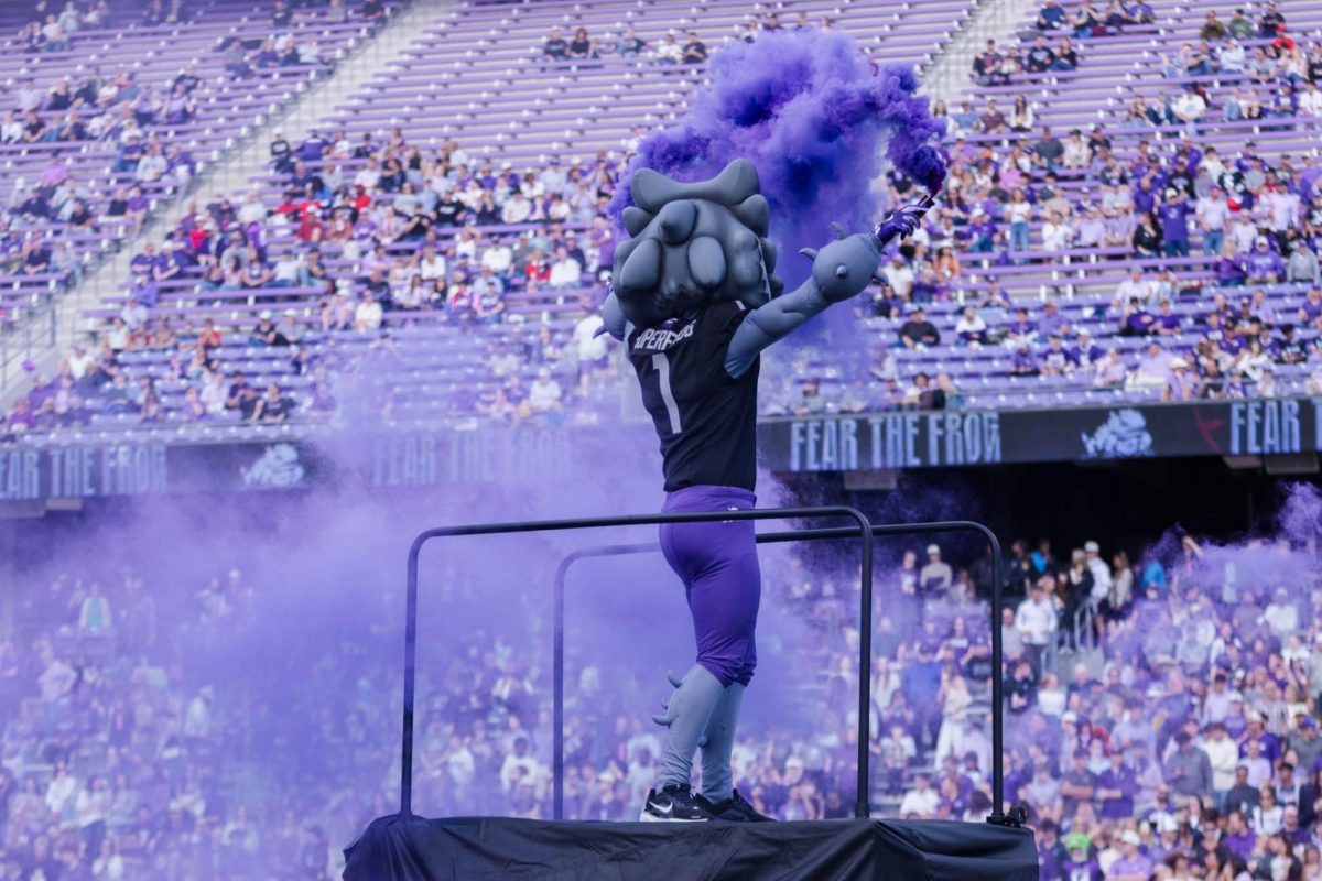 TCU SuperFrog releases smoke before the game at Amon G. Carter Stadium in Fort Worth, Texas, on Nov. 29, 2025. The TCU Horned Frogs beat the Cincinnati Bearcats 45–23. (TCU360/Nghia Tran)