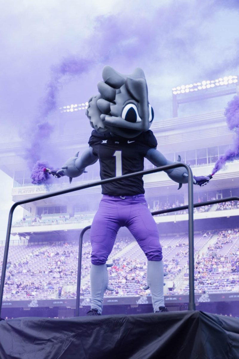 TCU SuperFrog releases smoke before the game at Amon G. Carter Stadium in Fort Worth, Texas, on Nov. 29, 2025. The TCU Horned Frogs beat the Cincinnati Bearcats 45–23. (TCU360/Nghia Tran)