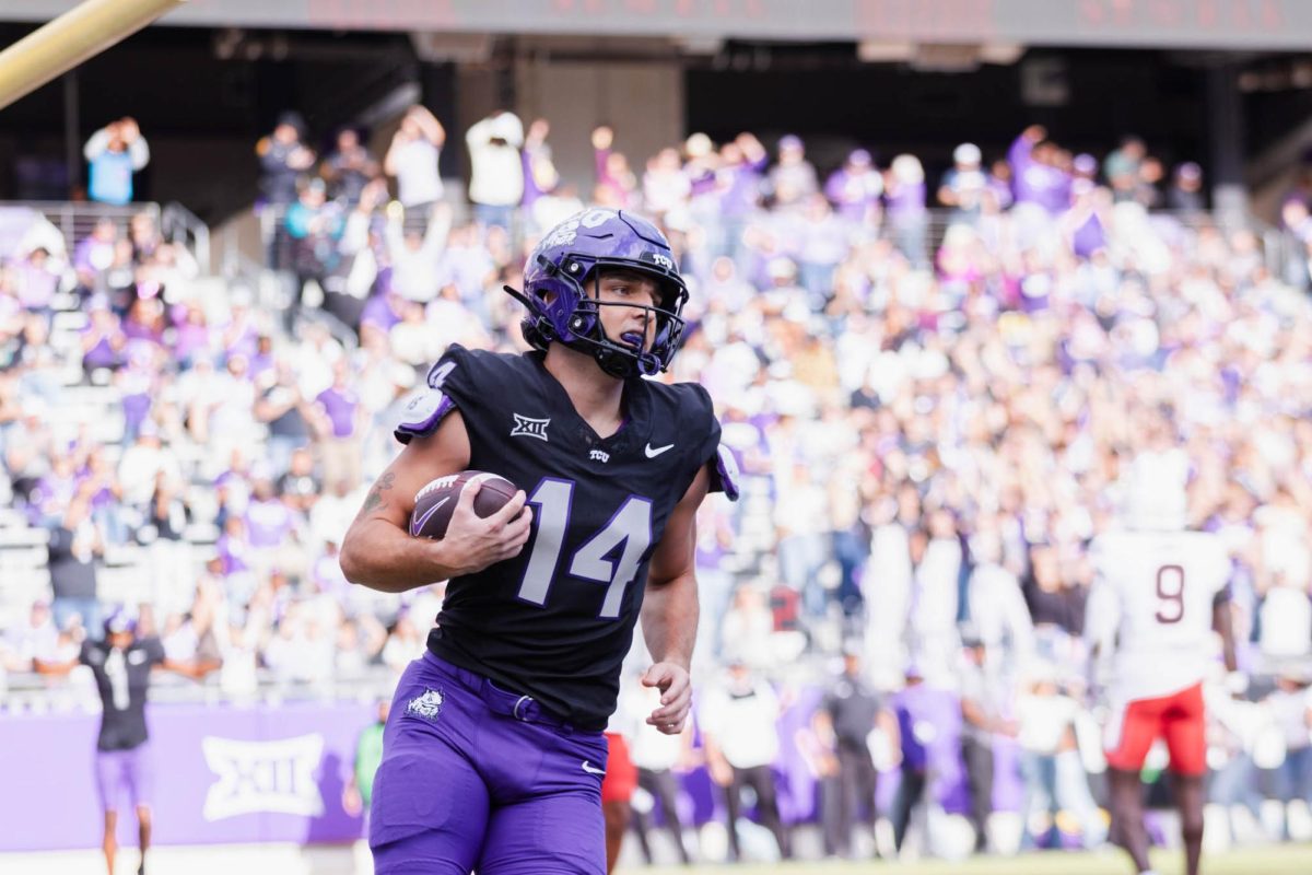 TCU Wide Receiver Joseph Manjack IV holds the ball while celebrating after scoring a touchdown at Amon G. Carter Stadium in Fort Worth, Texas, on Nov. 29, 2025. The TCU Horned Frogs beat the Cincinnati Bearcats 45–23. (TCU360/Nghia Tran)
