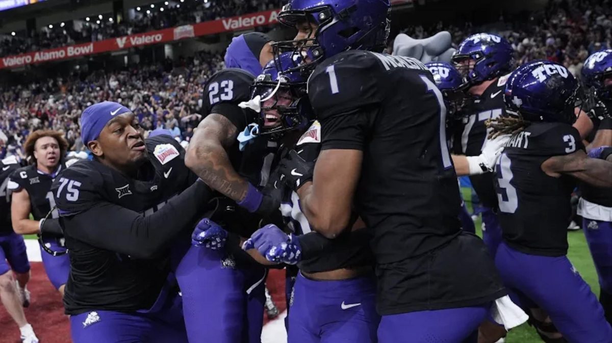 TCU running back Jeremy Payne, center, celebrates with teammates after he ran for a touchdown against Southern California during overtime in the Alamo Bowl NCAA college football game in San Antonio, Tuesday, Dec. 30, 2025. (AP Photo/Eric Gay)