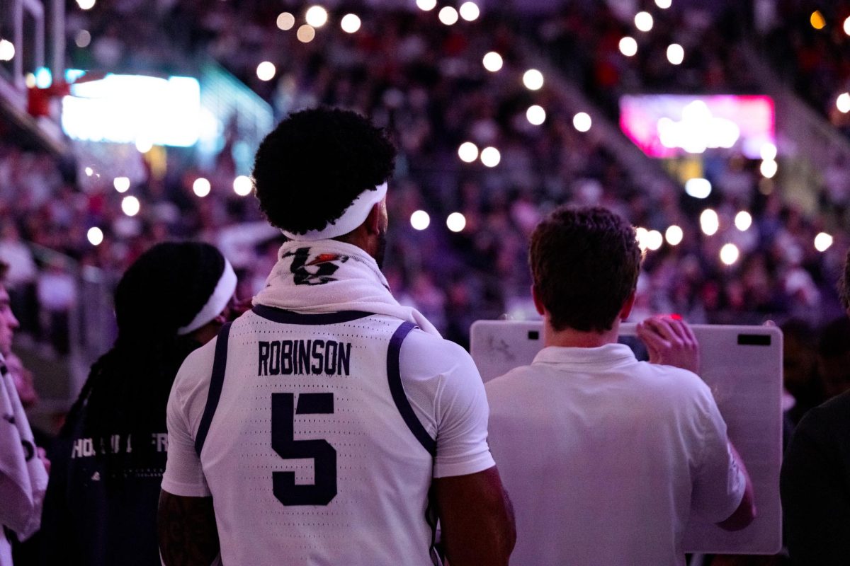 TCU forward Micah Robinson looks onwards during a timeout at Schollmaier Arena in Fort Worth, Texas, Jan. 10, 2026. The TCU Horned Frogs lost to the Arizona Wildcats 73-86.(TCU360/Tyler Wong)
