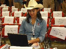 Sophomore Kimberly Dena blogs on Facebook at the floor of the National Republican Convention. Dena, 19, is the youngest member of the Texas delegation. Photo courtesy of Joel Fisher