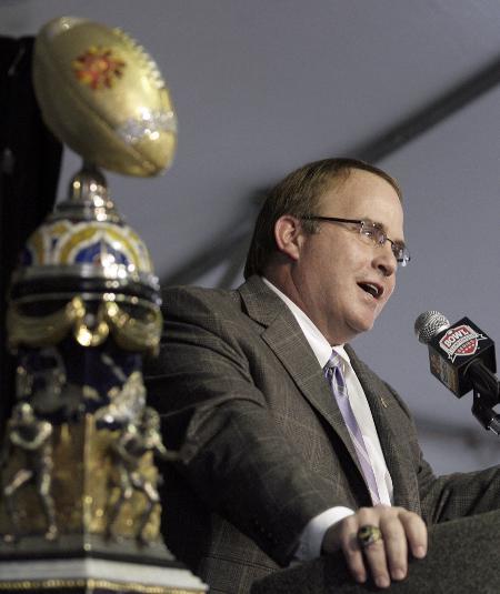 TCU coach Gary Patterson speaks during a during a news conference following the teams arrival at Sky Harbor International Airport on Tuesday, Dec. 29, 2009, in Phoenix. TCU will face Boise State in the Fiesta Bowl NCAA college football game Jan. 4. At left is the Fiesta Bowl trophy. Photo by Associated Press