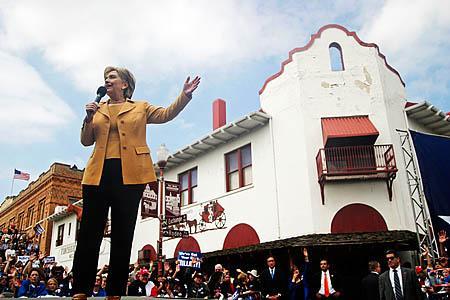 Clinton vows to turn speeches into solutions in Stockyards rally