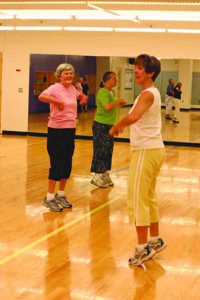 Participants in the Center for Healthy Aging exercise program stay healthy in the University Recreation Center. The program is sponsored by the nursing and kinesiology departments. Photo by Austin Bowler