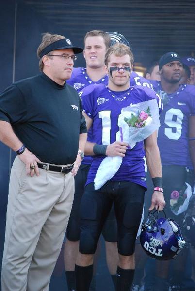 TCU head coach Gary Patterson stands with wide receiver Ryan Christian and other graduating seniors who gave a bouquet to their families before the home game against University of New Mexico on Nov. 28.