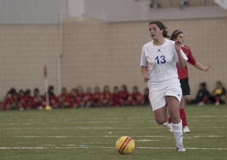 A soccer player for Colleyville Heritage high school surveys the field in a game against Midland High School on Friday. The game, a part of the Red Bull Nolan Showcase that features local high schools womens soccer programs, was moved indoors inside the Sam Baugh Indoor Practice Facility because of the cold weather.